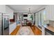 Modern kitchen with stainless steel fridge, breakfast nook, and sleek countertops at 5810 Old Mill Trce, Lithonia, GA 30038