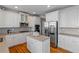 Spacious kitchen with stainless appliances, an island, and white cabinetry at 5810 Old Mill Trce, Lithonia, GA 30038