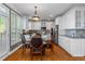 Bright eat-in kitchen with hardwood floors, white cabinets, stainless appliances, and lots of natural light at 5810 Old Mill Trce, Lithonia, GA 30038