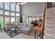 Bright and airy living room with large windows and open access to the kitchen and dining area at 5810 Old Mill Trce, Lithonia, GA 30038