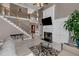 The living room features a cozy fireplace, high ceilings, staircase and large windows for natural light at 5810 Old Mill Trce, Lithonia, GA 30038