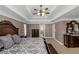 Main bedroom with tray ceilings, neutral decor, natural light, and and vanities at 5810 Old Mill Trce, Lithonia, GA 30038