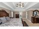 Comfortable main bedroom with neutral walls, dark wood furniture, and soft natural light at 5810 Old Mill Trce, Lithonia, GA 30038