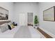 Cozy bedroom featuring a comfortable bed, artwork, and access to a bathroom at 845 Spring Nw St # Ph 5, Atlanta, GA 30308