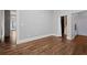 Spacious bedroom featuring hardwood floors, neutral walls and trim, with a walk-in closet and attached bath at 845 Spring Nw St # Ph 5, Atlanta, GA 30308