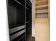This walk-in closet has multiple storage areas, shelving, hanging space, and drawers with light colored wood at 845 Spring Nw St # Ph 5, Atlanta, GA 30308