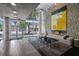 Spacious lobby with stone wall, comfortable sofa, and large glass windows with city views at 845 Spring Nw St # Ph 5, Atlanta, GA 30308