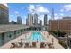 Rooftop pool deck with city views, lounge chairs, and well-maintained landscaping in a modern setting at 845 Spring Nw St # Ph 5, Atlanta, GA 30308