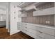 Walk-in closet with built-in drawers and floating shelves for storage at 845 Spring Nw St # Ph 5, Atlanta, GA 30308