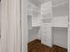 Spacious walk-in closet with custom shelving and ample storage space at 845 Spring Nw St # Ph 5, Atlanta, GA 30308
