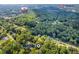 Aerial view of the property and surrounding neighborhood, highlighting its proximity to a shopping center at 4890 Old Briar Trl, Douglasville, GA 30135