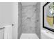 Modern bathroom with sleek marble tile shower and a convenient niche at 4890 Old Briar Trl, Douglasville, GA 30135