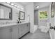 Elegant bathroom features double sinks, modern fixtures, and a marble-tiled shower at 4890 Old Briar Trl, Douglasville, GA 30135
