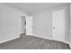 This bedroom offers neutral walls and flooring with a closet and a window at 4890 Old Briar Trl, Douglasville, GA 30135