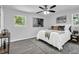 Stylishly staged bedroom featuring neutral colors, wood-look floors and comfortable furnishings at 4890 Old Briar Trl, Douglasville, GA 30135