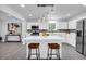 Beautiful kitchen with stainless steel appliances, stone countertops, and a breakfast bar at 4890 Old Briar Trl, Douglasville, GA 30135