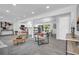 Open-concept living space featuring neutral decor, recessed lighting and wood-look flooring at 4890 Old Briar Trl, Douglasville, GA 30135