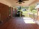 View from covered patio with railing overlooking a sprawling backyard and mature trees at 893 Andrews Dr, Conyers, GA 30012