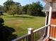 Lush green backyard with trees, visible from the patio, offering a peaceful outdoor setting at 893 Andrews Dr, Conyers, GA 30012