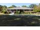 Charming brick home featuring a well-manicured lawn and mature landscaping with decorative bushes at 893 Andrews Dr, Conyers, GA 30012