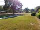 Expansive front yard with green grass and trimmed bushes on a sunny day at 893 Andrews Dr, Conyers, GA 30012