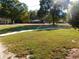 Expansive front yard featuring mature trees and lush green grass at 893 Andrews Dr, Conyers, GA 30012