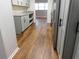 Galley kitchen featuring shaker cabinets, granite countertops, and stainless steel appliances at 893 Andrews Dr, Conyers, GA 30012