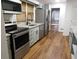 Updated kitchen featuring stainless steel appliances and ample cabinet space at 893 Andrews Dr, Conyers, GA 30012