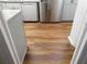 The modern kitchen features stainless steel appliances, granite countertops and wood floors at 893 Andrews Dr, Conyers, GA 30012