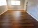 Bright living room with wood flooring and neutral decor, offering a versatile space at 893 Andrews Dr, Conyers, GA 30012