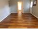 Cozy living room with wood flooring and ample natural light, leading to other rooms at 893 Andrews Dr, Conyers, GA 30012