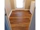 Practical mud room features durable flooring and a door to the outside for convenience at 893 Andrews Dr, Conyers, GA 30012