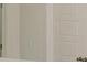 Bathroom features a double sink vanity, tile floors, and a paneled door at 6545 Rhett Run, Cumming, GA 30028