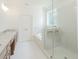 Bright bathroom with a glass shower, soaking tub, double vanity, and modern fixtures at 6545 Rhett Run, Cumming, GA 30028