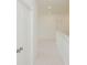 Upstairs hallway featuring a five-panel door at 6545 Rhett Run, Cumming, GA 30028