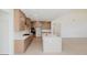 Spacious kitchen with stainless appliances, island, and beautiful wooden cabinets and flooring at 6545 Rhett Run, Cumming, GA 30028
