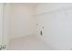 Clean laundry room featuring tiled floors and a metal shelving unit at 6545 Rhett Run, Cumming, GA 30028