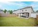 Expansive backyard featuring a well-maintained lawn, a fence, and an outdoor living area at 149 Woodhouse Cir, Acworth, GA 30102