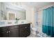 Bright bathroom featuring double sinks, a large mirror, and a shower-tub combination at 149 Woodhouse Cir, Acworth, GA 30102