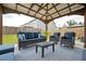 Relaxing covered patio features comfortable seating and stylish decor for outdoor living and enjoyment of the backyard at 149 Woodhouse Cir, Acworth, GA 30102