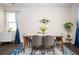 Bright dining room with a modern table, stylish chairs, and elegant decor at 149 Woodhouse Cir, Acworth, GA 30102