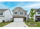 Charming two-story home with a brick-accented facade, well-manicured lawn, and a two-car garage at 149 Woodhouse Cir, Acworth, GA 30102