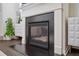 Cozy fireplace featuring a dark hearth and white mantel, creating a warm atmosphere at 149 Woodhouse Cir, Acworth, GA 30102