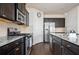 Well-equipped kitchen with stainless steel appliances and granite countertops at 149 Woodhouse Cir, Acworth, GA 30102