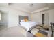 Well-lit main bedroom with a large bed, stylish rug, and neutral decor at 149 Woodhouse Cir, Acworth, GA 30102
