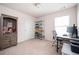 Well-lit home office with a desk, shelving, and a comfortable workspace at 149 Woodhouse Cir, Acworth, GA 30102