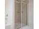 Tiled walk-in shower with glass enclosure in a modern bathroom at 149 Woodhouse Cir, Acworth, GA 30102