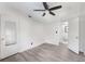 Inviting bedroom features sleek gray floors, modern ceiling fan, and convenient access to a bathroom at 330 3Rd St # Apt 1, Atlanta, GA 30308