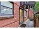 Private entrance featuring awning and brick walls, adding charm to this inviting outdoor space at 330 3Rd St # Apt 1, Atlanta, GA 30308