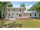 A two-story home boasting a backyard with brick patio and mature trees at 56 Carlane Cir, Bowdon, GA 30108